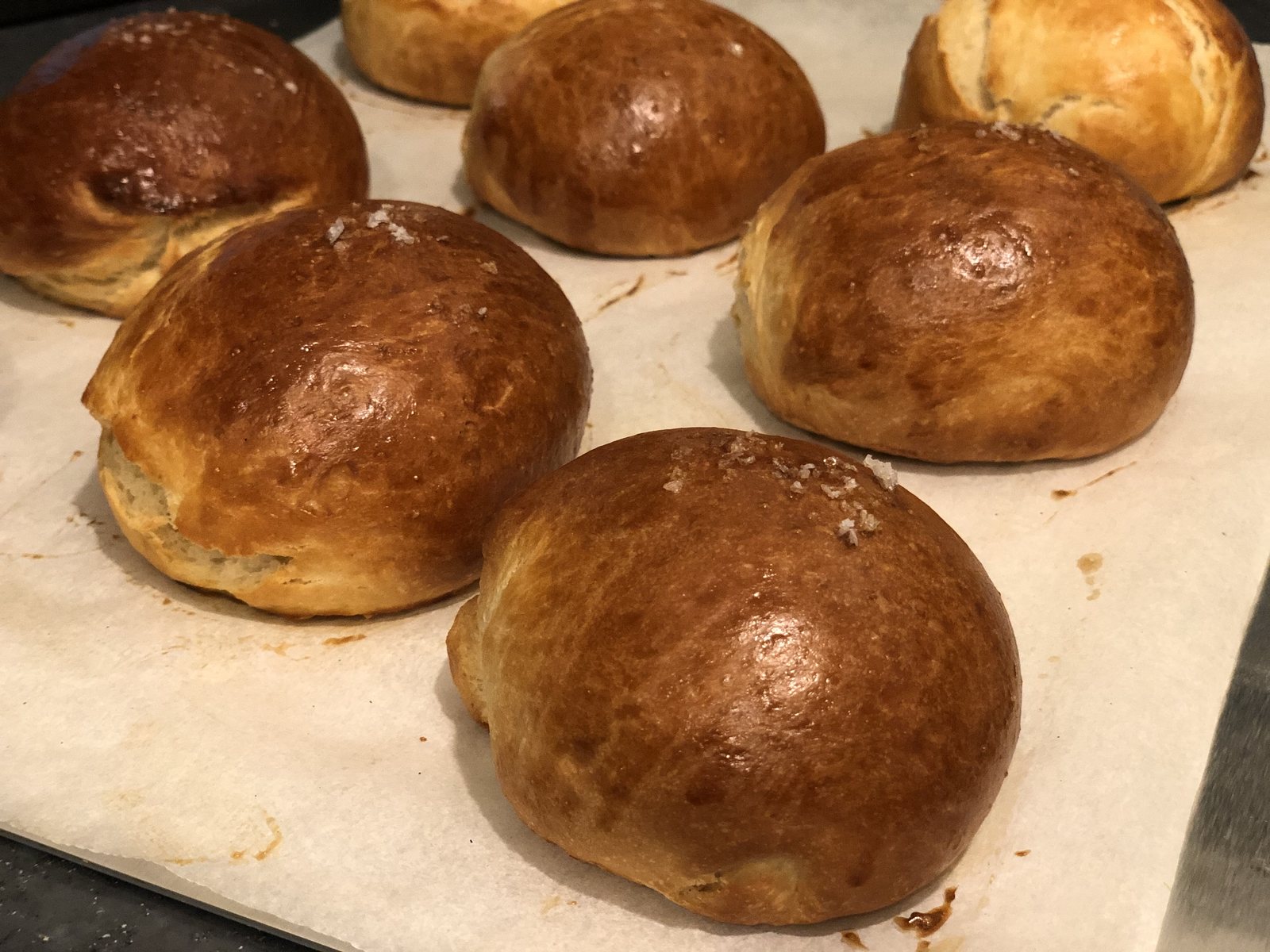 Glazed brioche rolls with salt flakes